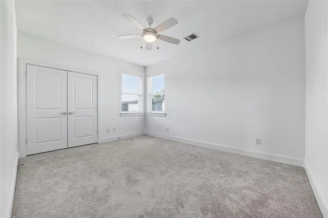 a bathroom view of a toilet and a shower