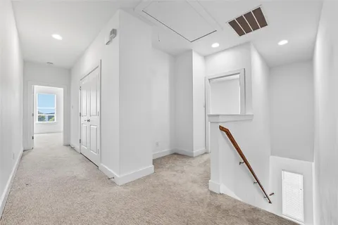 a view of a hallway with closet