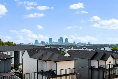 a terrace with outdoor seating and city view