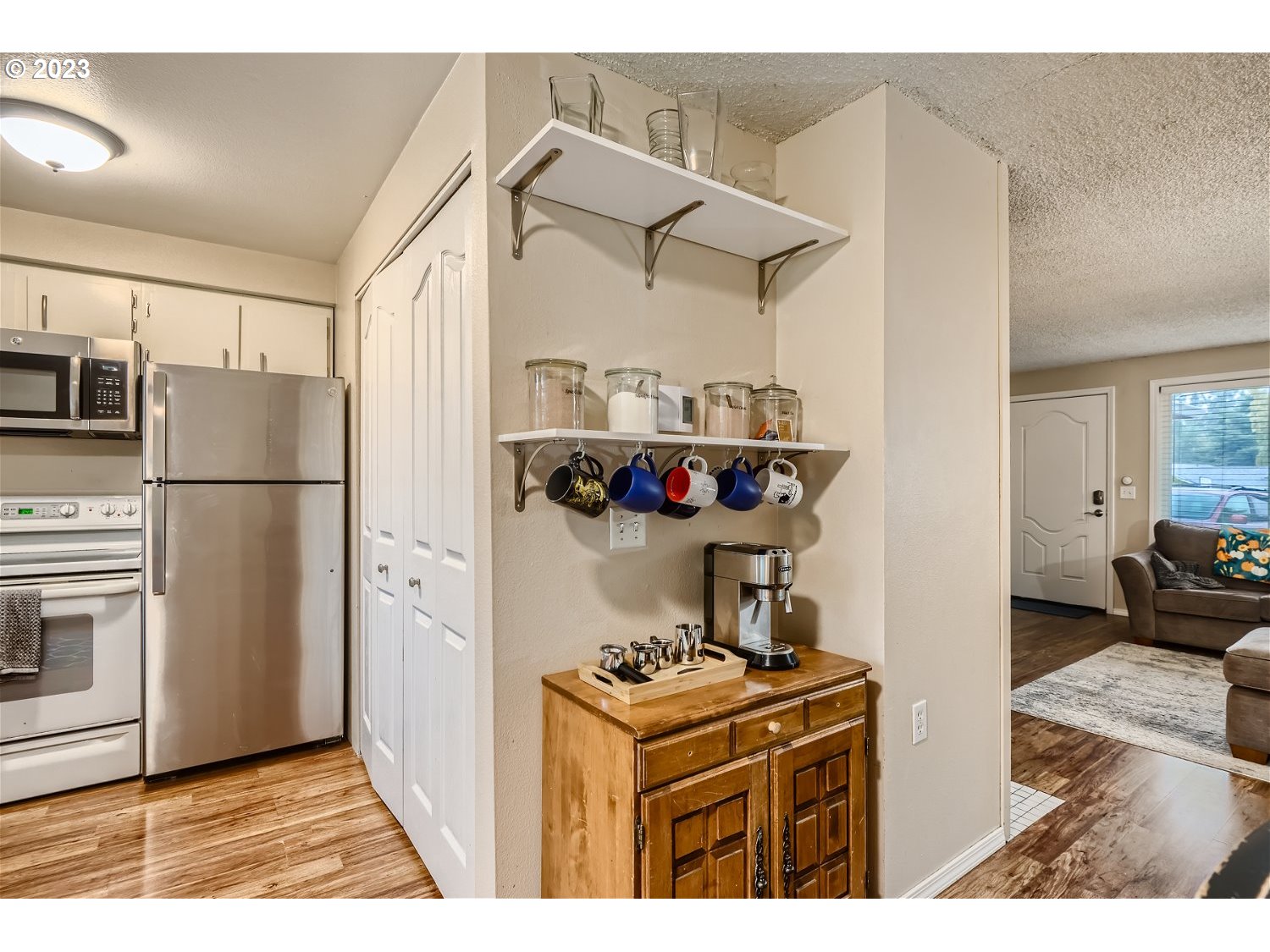 885 Southeast Lambert Circle Gresham, OR 97080 - Photo 12 of 45 a kitchen with stainless steel appliances granite countertop a stove a refrigerator and a refrigerator