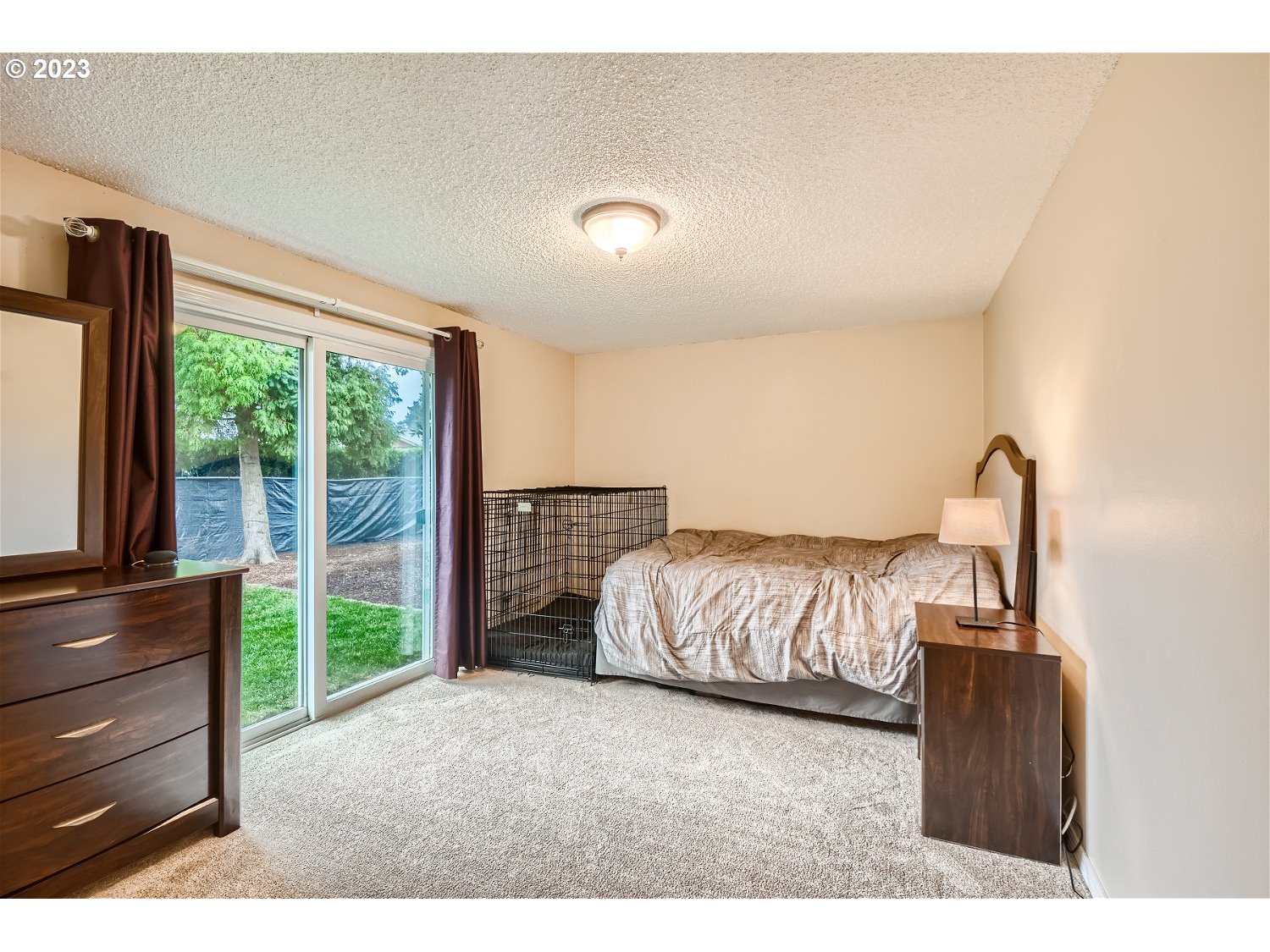 885 Southeast Lambert Circle Gresham, OR 97080 - Photo 14 of 45 a bedroom with a bed and a dresser next to a window
