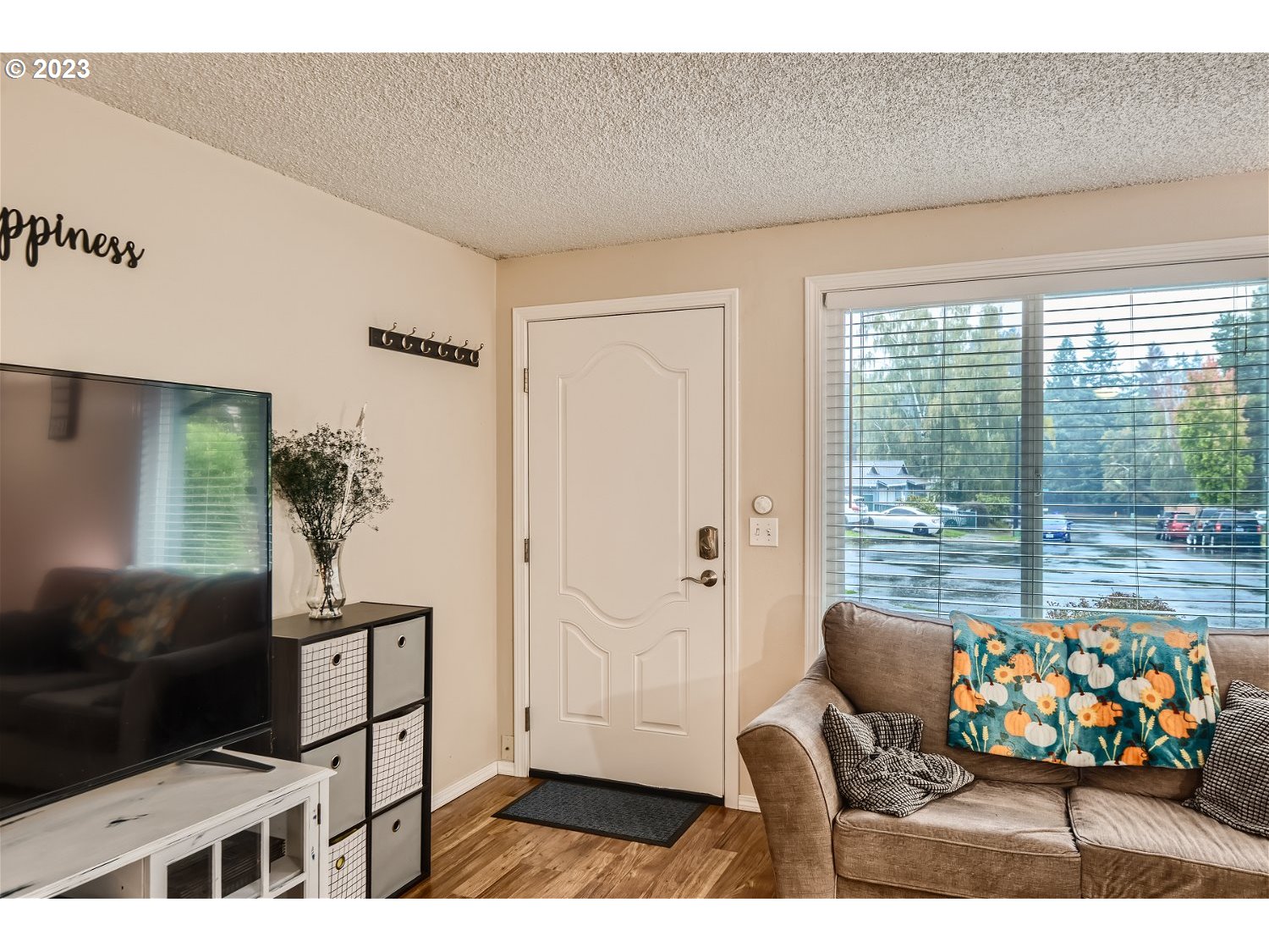 885 Southeast Lambert Circle Gresham, OR 97080 - Photo 5 of 45 a living room with furniture and a floor to ceiling window