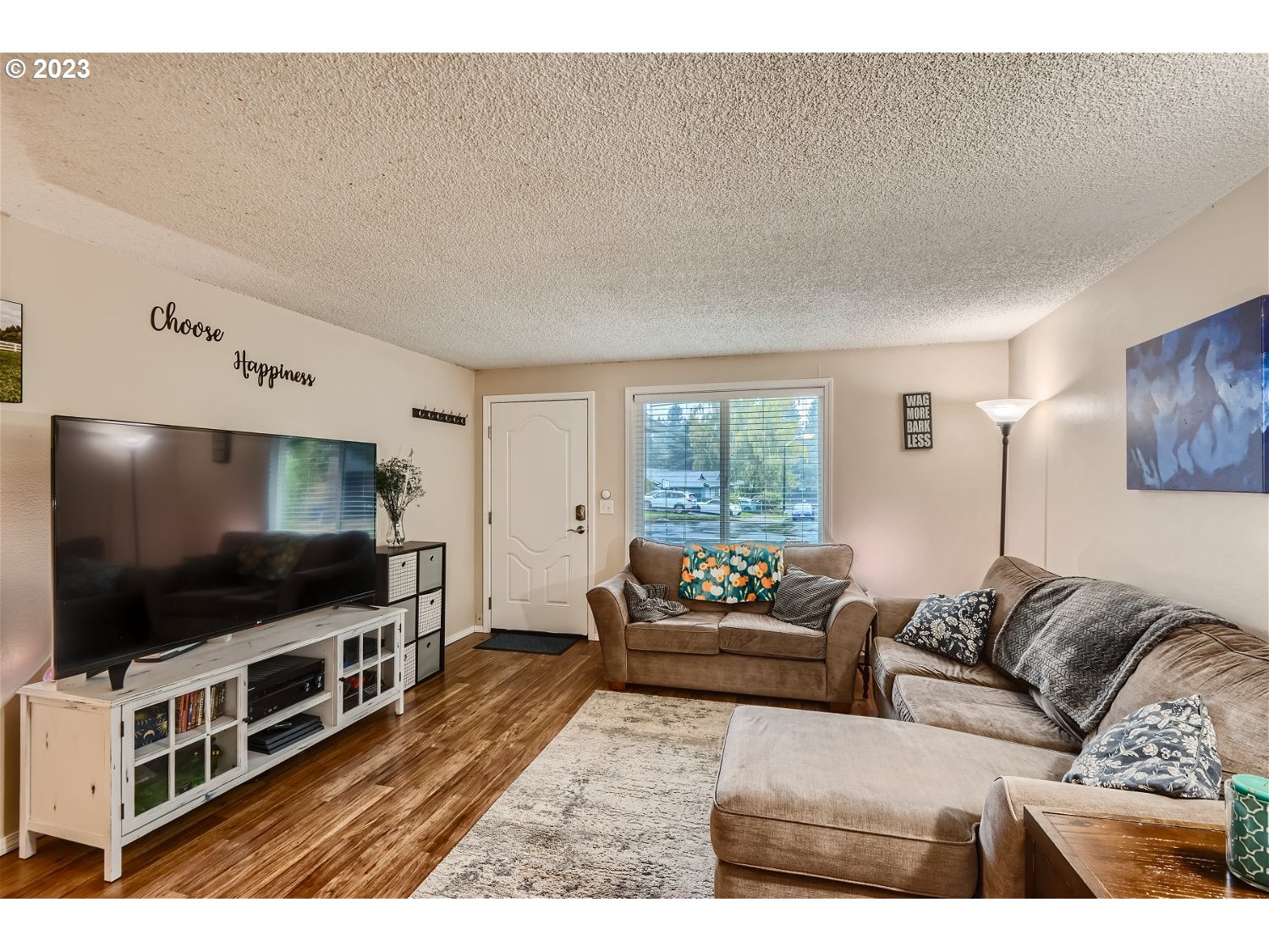 885 Southeast Lambert Circle Gresham, OR 97080 - Photo 6 of 45 a living room with furniture and a flat screen tv