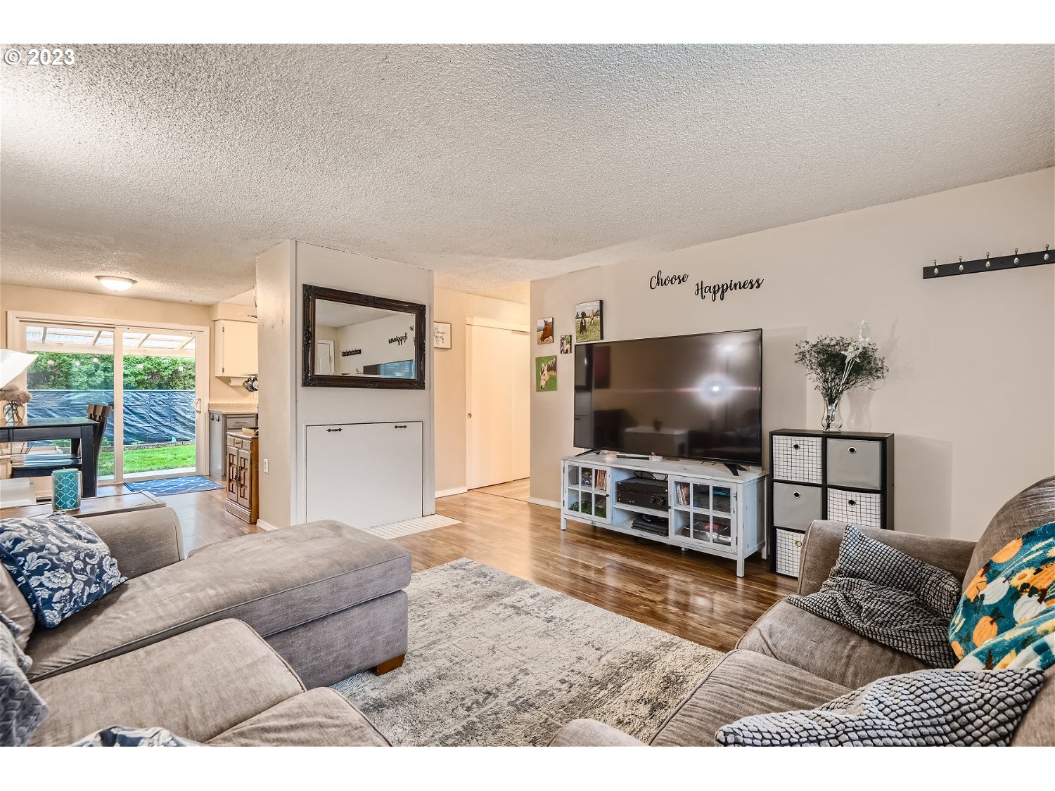 885 Southeast Lambert Circle Gresham, OR 97080 - Photo 9 of 45 a living room with furniture and a flat screen tv