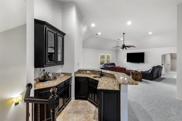 a kitchen with stainless steel appliances granite countertop a stove and a sink