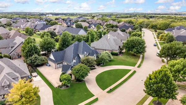 an aerial view of a house with a swimming pool yard and outdoor seating
