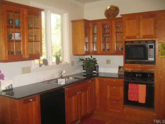 2304 Cranford Road Durham, NC 27705 - Photo 6 of 12 Custom kitchen renovated in 1997.Grantie countertops,cherry cabinets(some with glass fronts) built-in wall oven/microwave,cook-top range, Bosch diswasher.Harwood floors. Other