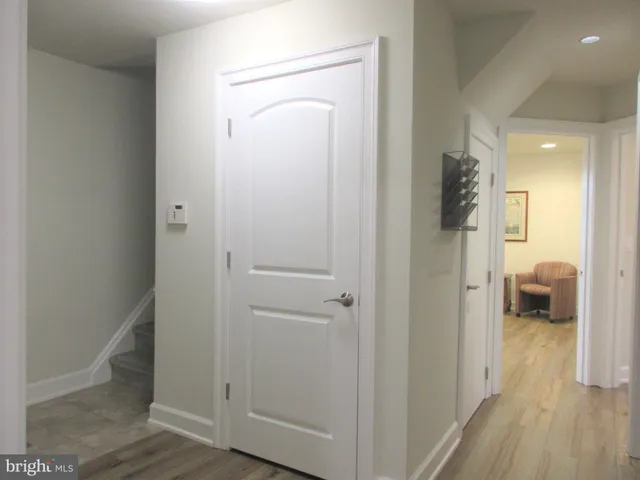 a view of a bathroom from a hallway