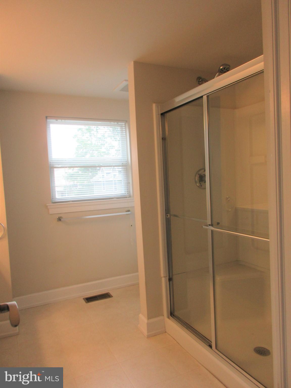 10 North Stiles Avenue Maple Shade, NJ 08052 - Photo 16 of 19 a bathroom with a bath tub and a shower