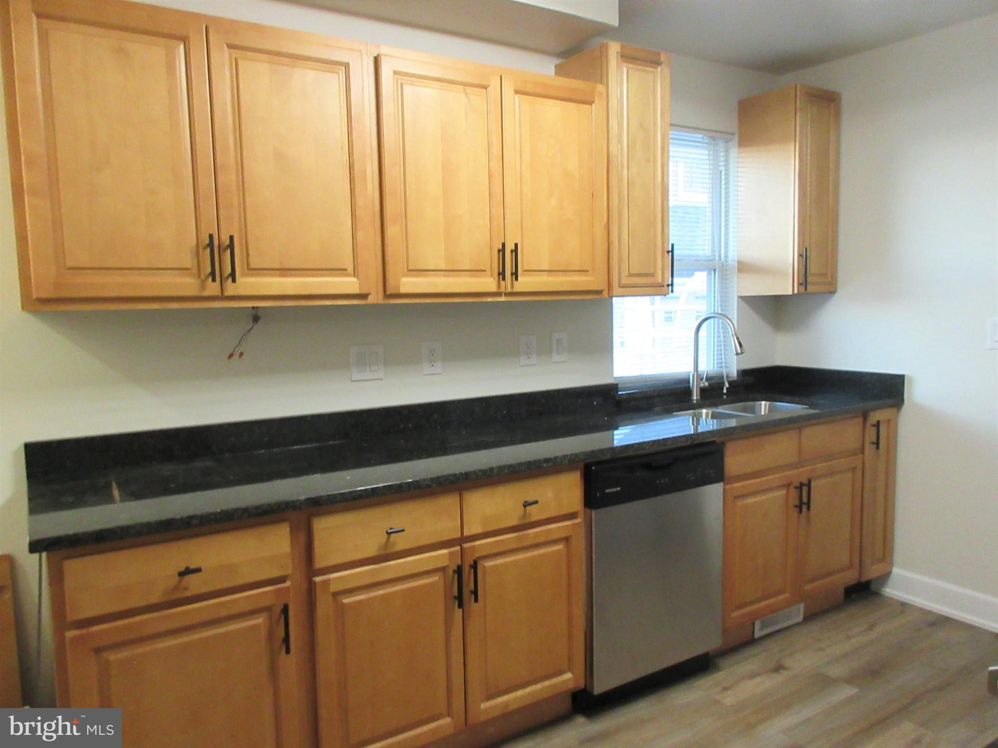 10 North Stiles Avenue Maple Shade, NJ 08052 - Photo 3 of 19 a kitchen with granite countertop white cabinets and sink