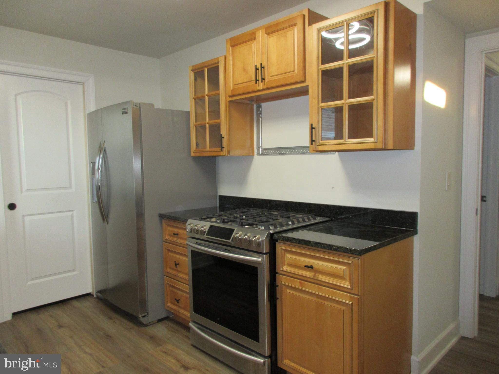 10 North Stiles Avenue Maple Shade, NJ 08052 - Photo 4 of 19 a kitchen with stainless steel appliances granite countertop a stove and a refrigerator