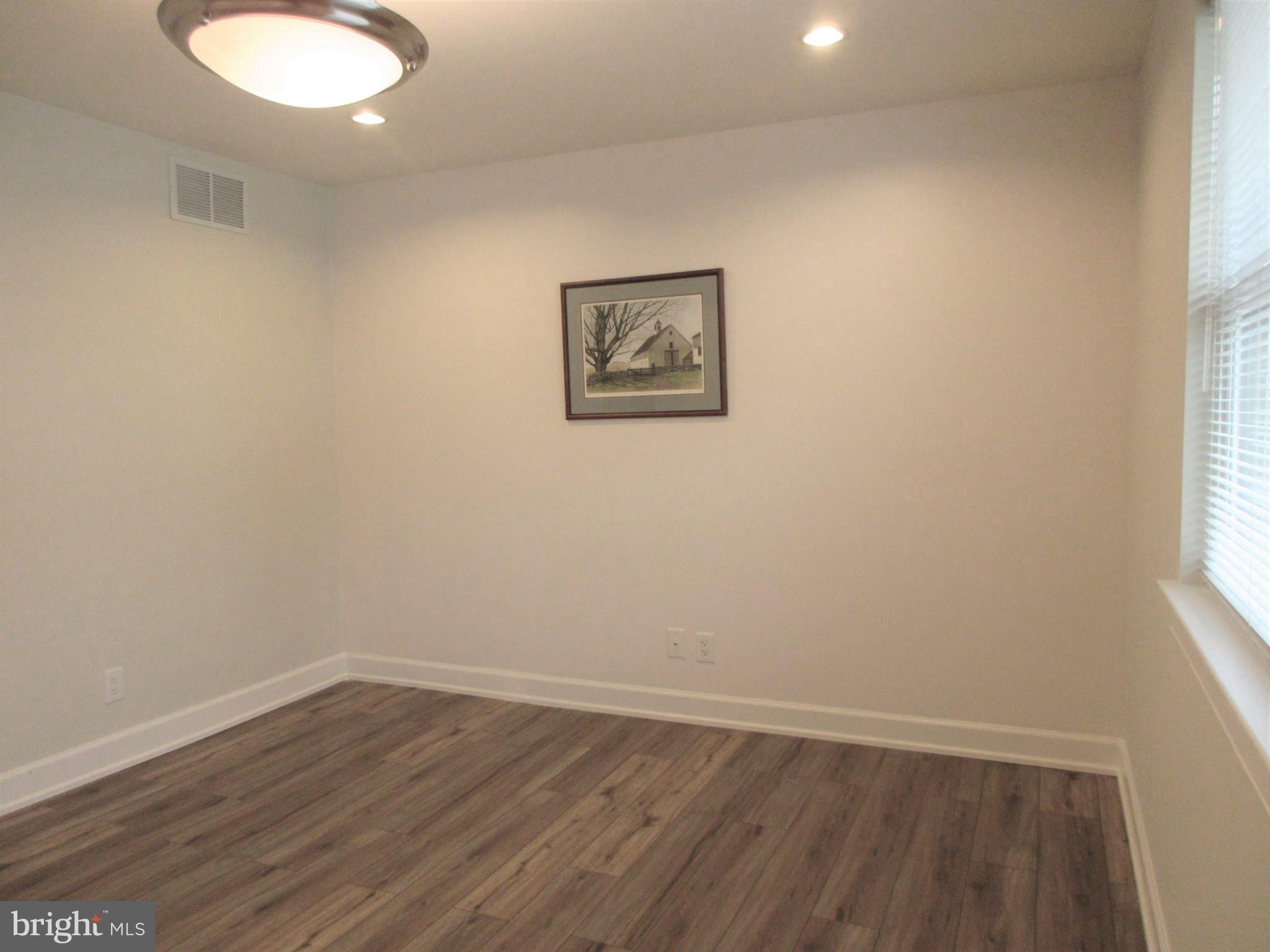 10 North Stiles Avenue Maple Shade, NJ 08052 - Photo 9 of 19 wooden floor in an empty room with a window