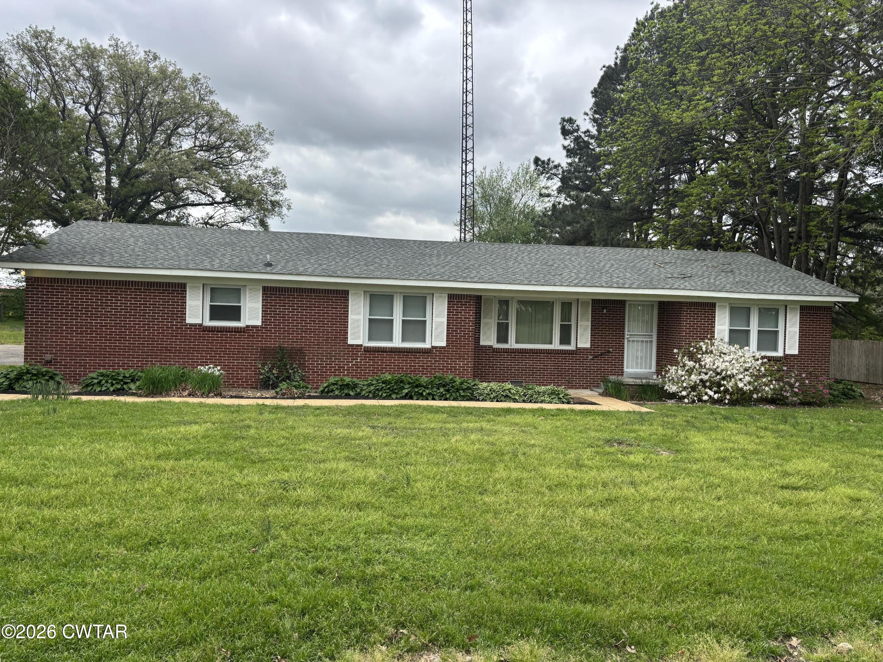 17 Brazil Schoolhouse Road Trenton, TN 38382 - Photo 1 of 21 a front view of a house with a garden