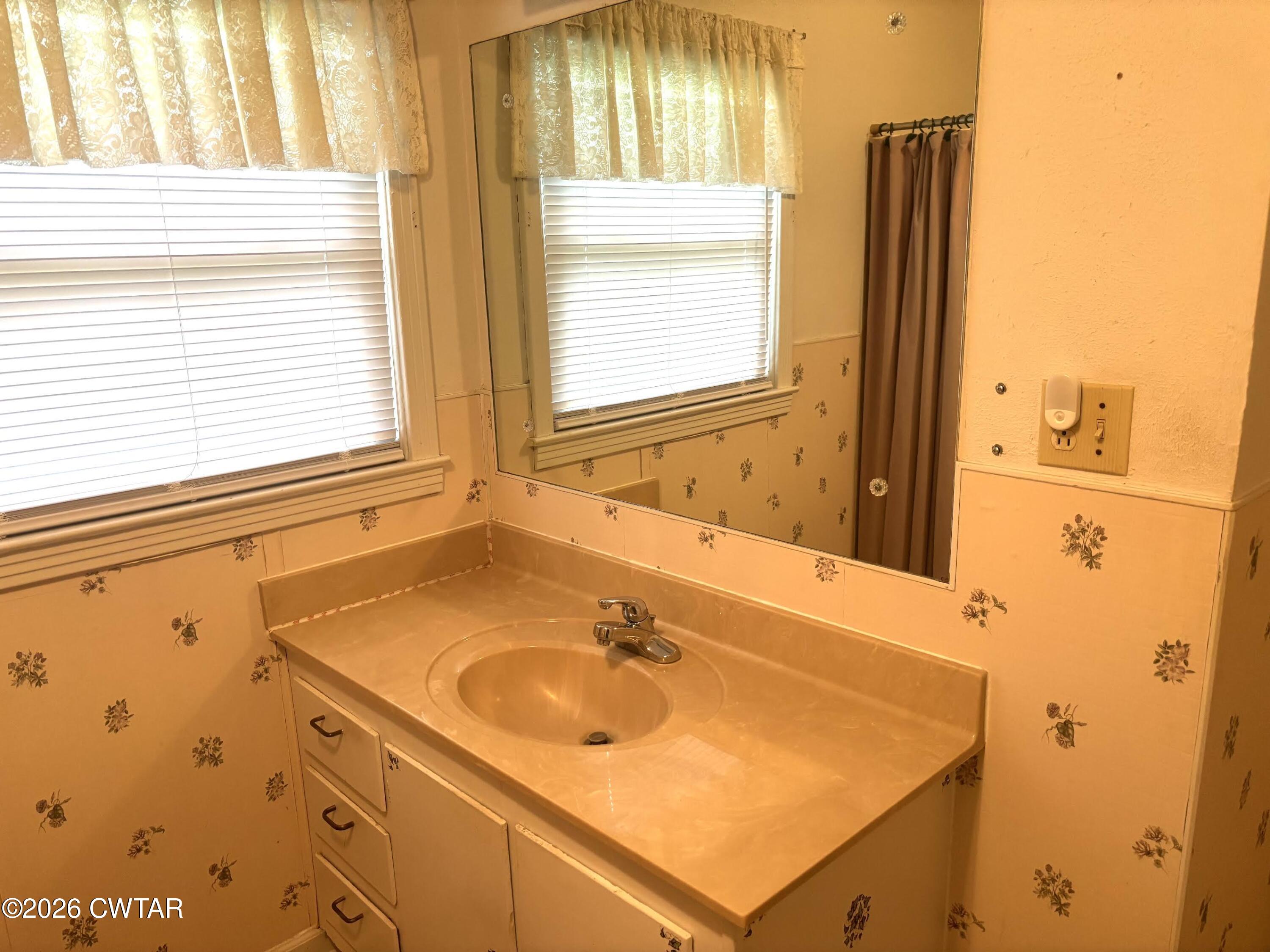 17 Brazil Schoolhouse Road Trenton, TN 38382 - Photo 21 of 21 a bathroom with a sink and a mirror