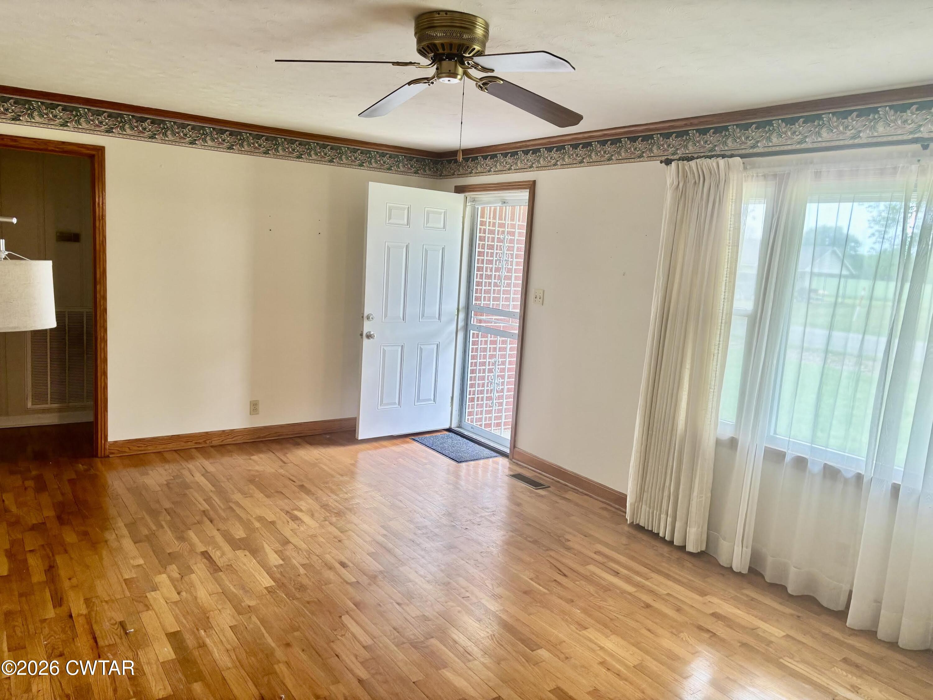17 Brazil Schoolhouse Road Trenton, TN 38382 - Photo 8 of 21 a view of an empty room with glass door