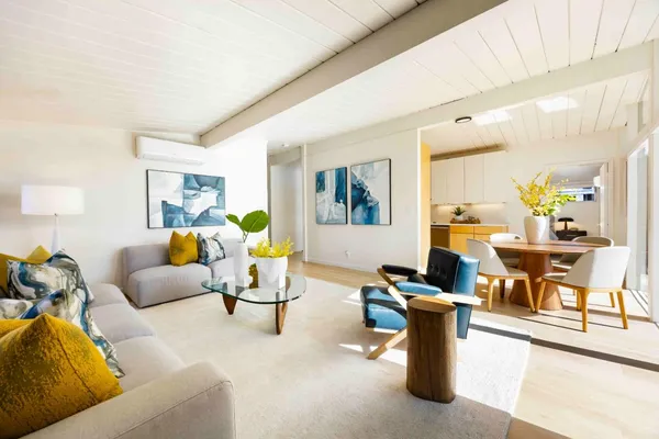 a living room with furniture and a table