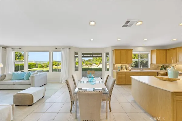 a living room with furniture and large windows
