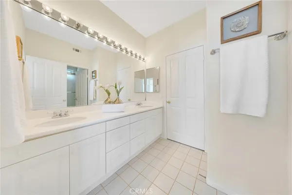 a view of a bathroom with a walk in closet
