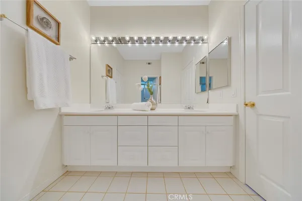 a view of walk in closet with white walls