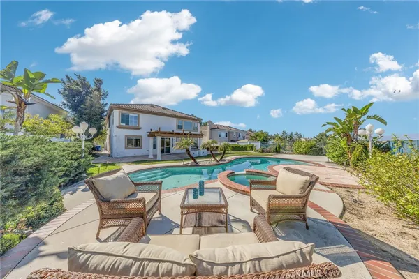 an aerial view of a house with a swimming pool