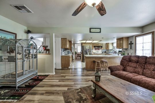 1213 Andrea Court Ridgecrest, CA 93555 - Photo 15 of 50 a living room with furniture and a large window