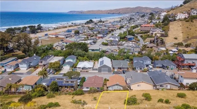 an aerial view of a houses with a swimming pool