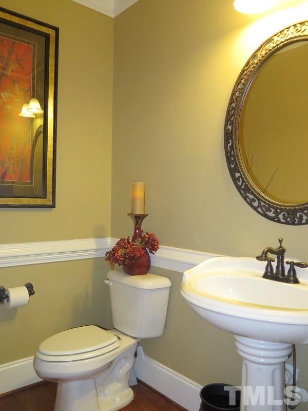8733 Oregon Inlet Court Raleigh, NC 27603 - Photo 17 of 19 a bathroom with a sink and a mirror