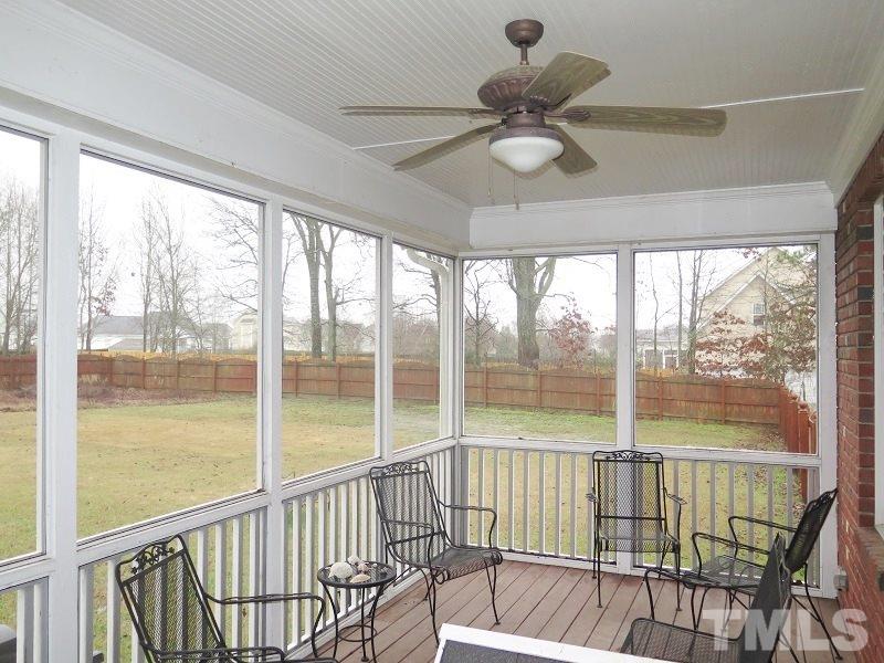 8733 Oregon Inlet Court Raleigh, NC 27603 - Photo 18 of 19 a view of a balcony with a ceiling fan