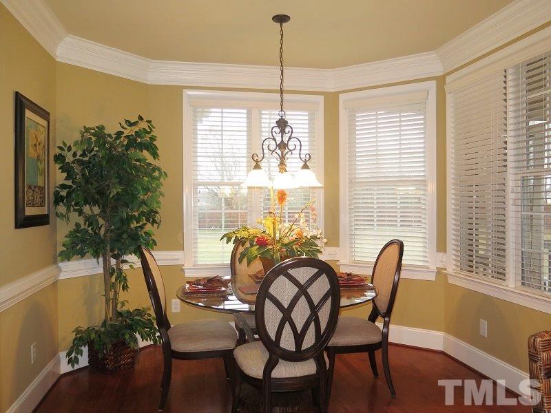 8733 Oregon Inlet Court Raleigh, NC 27603 - Photo 7 of 19 a dining room with furniture and window