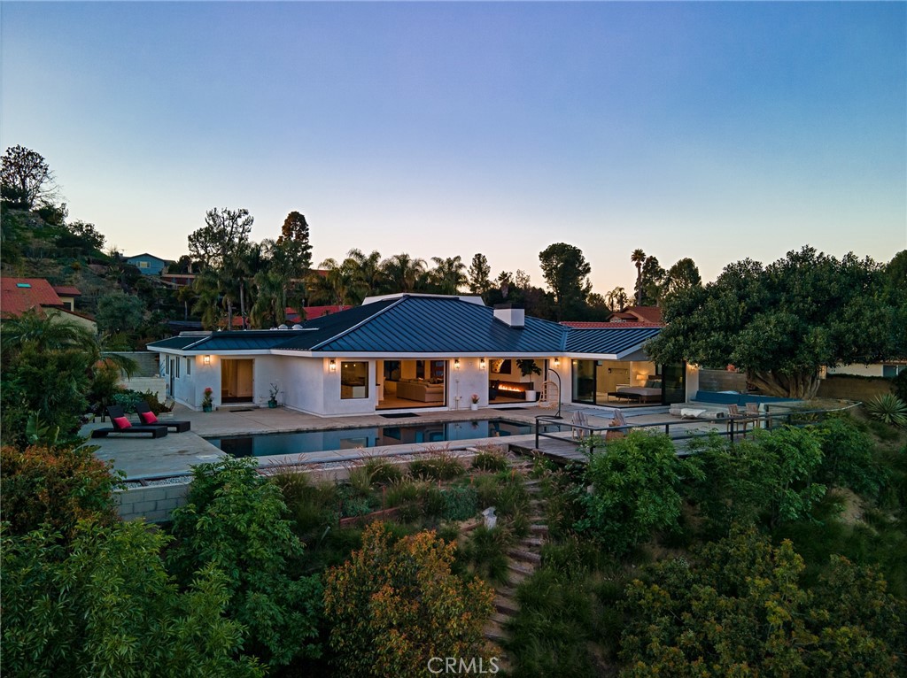 10631 Equestrian Drive North Tustin, CA 92705 - Photo 1 of 35 a view of a house with a yard and potted plants