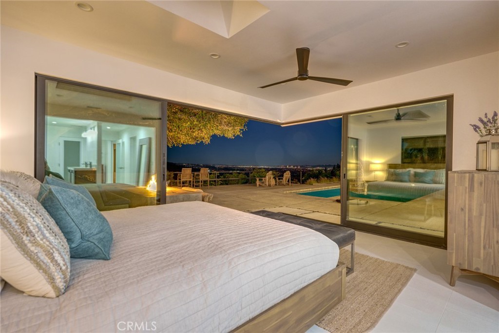 10631 Equestrian Drive North Tustin, CA 92705 - Photo 13 of 35 a bedroom with a bed and a view of living room