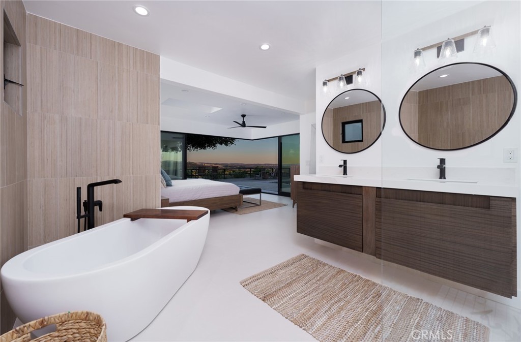 10631 Equestrian Drive North Tustin, CA 92705 - Photo 15 of 35 a living room with furniture and a large mirror