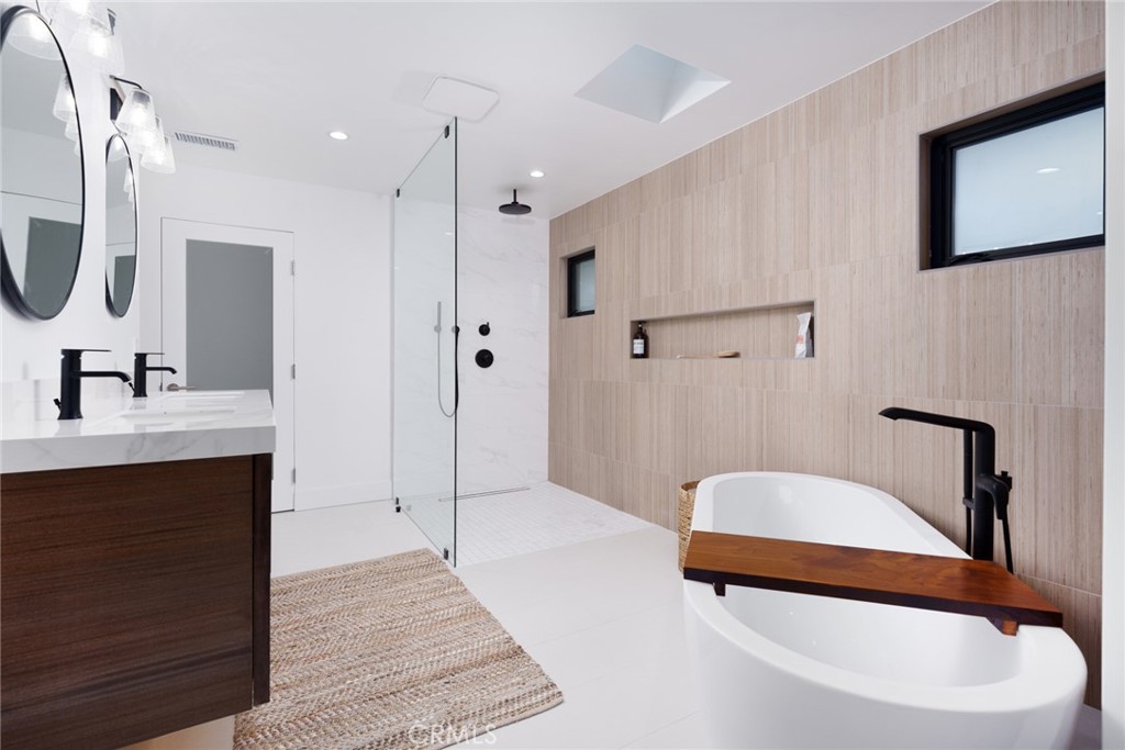 10631 Equestrian Drive North Tustin, CA 92705 - Photo 16 of 35 a bathroom with a sink and a mirror