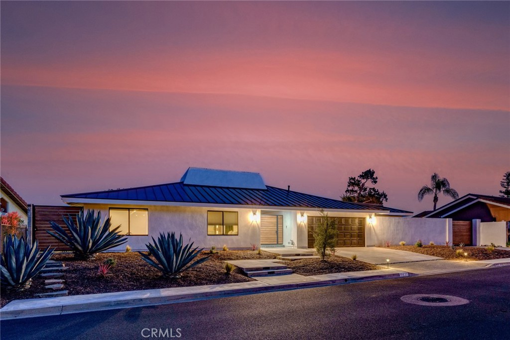 10631 Equestrian Drive North Tustin, CA 92705 - Photo 2 of 35 a front view of a house with garden