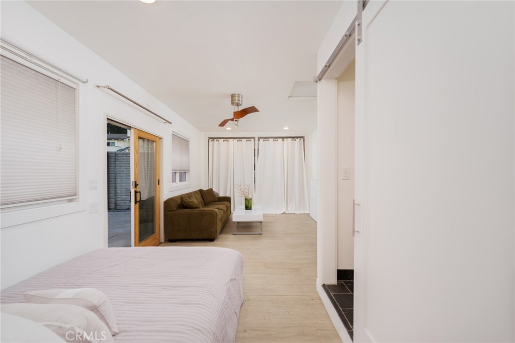 10631 Equestrian Drive North Tustin, CA 92705 - Photo 24 of 35 a bedroom with a bed and a couch