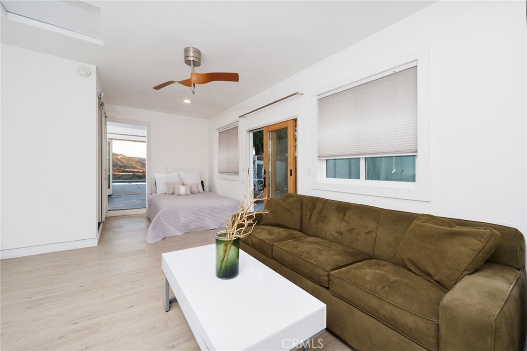 10631 Equestrian Drive North Tustin, CA 92705 - Photo 26 of 35 a living room with furniture and wooden floor