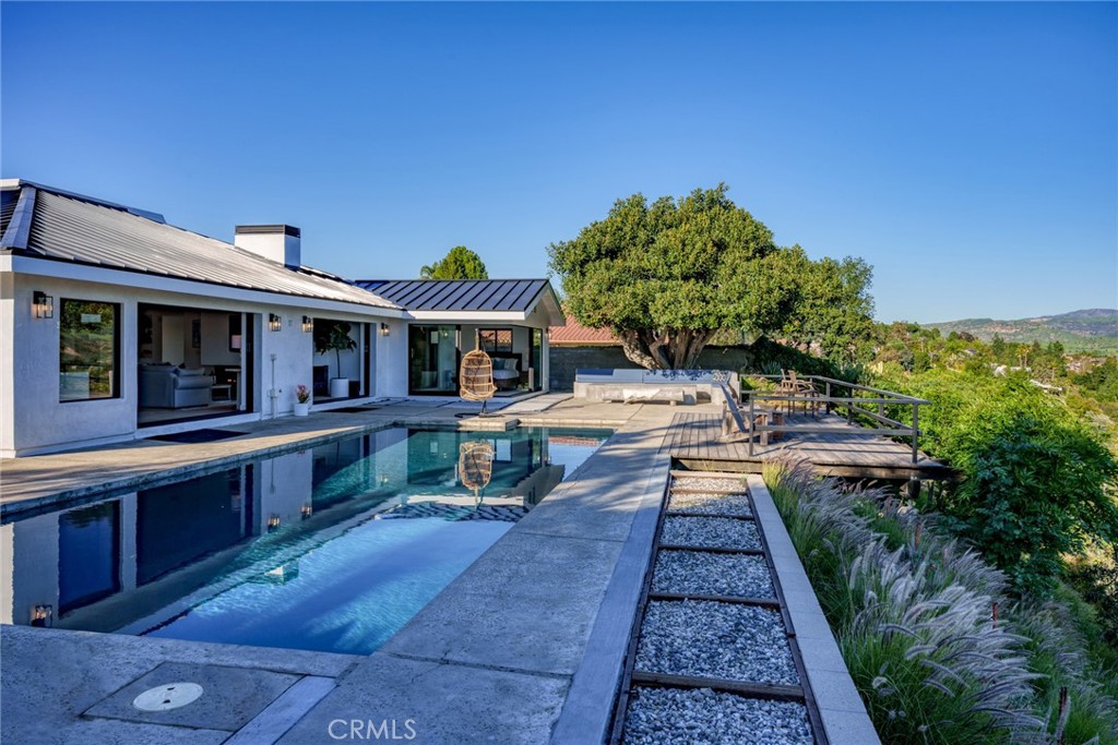 10631 Equestrian Drive North Tustin, CA 92705 - Photo 27 of 35 a view of house with swimming pool outdoor seating