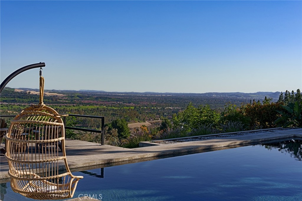 10631 Equestrian Drive North Tustin, CA 92705 - Photo 31 of 35 a view of a balcony with floor to ceiling window and wooden floor