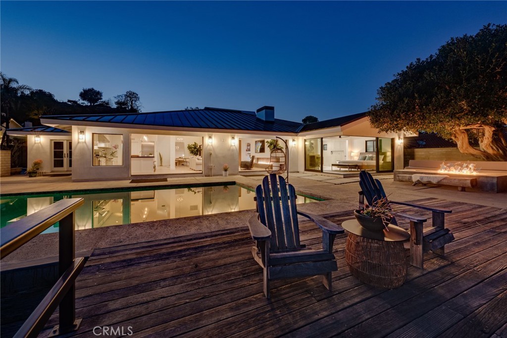 10631 Equestrian Drive North Tustin, CA 92705 - Photo 32 of 35 a view of a swimming pool with seating area