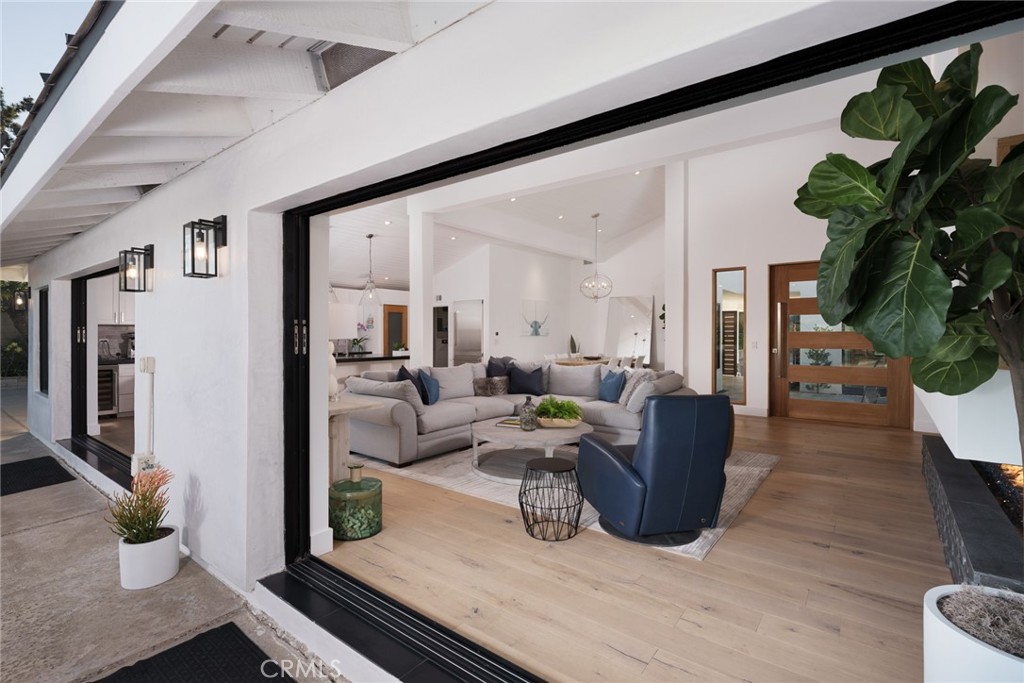 10631 Equestrian Drive North Tustin, CA 92705 - Photo 10 of 35 a living room with furniture and a potted plant