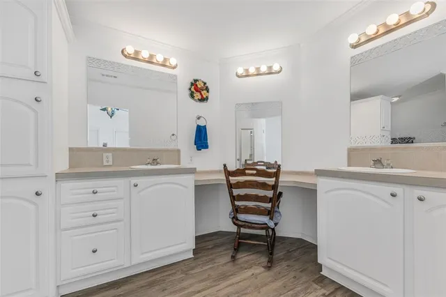 a spacious bathroom with a sink a mirror and a bathtub
