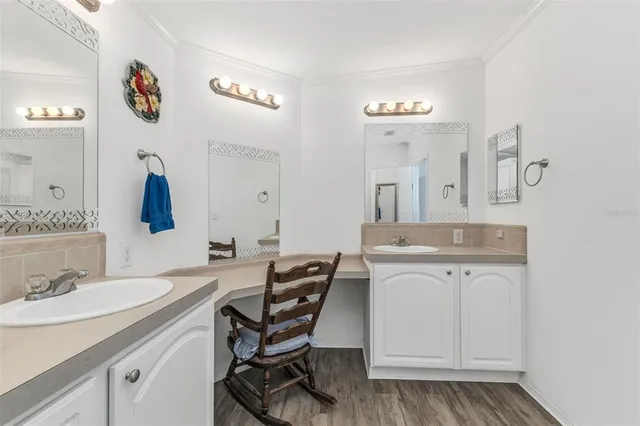 a bathroom with a sink a vanity and a mirror