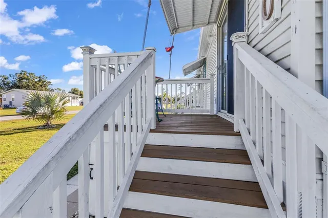 a view of a balcony with furniture