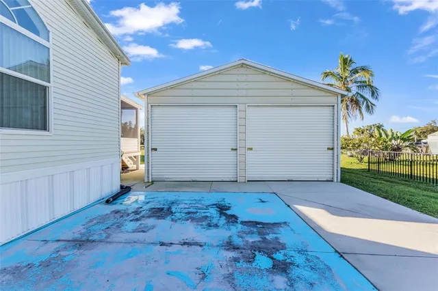 a big yard with lots of green space and palm trees