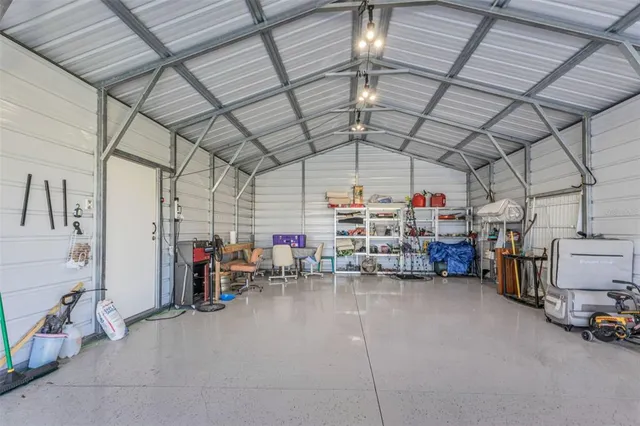 an aerial view of a residential houses with outdoor space