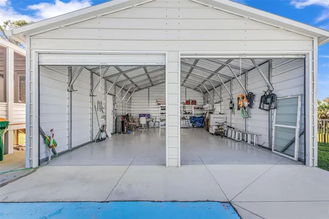 a view of a house with swimming pool yard and patio