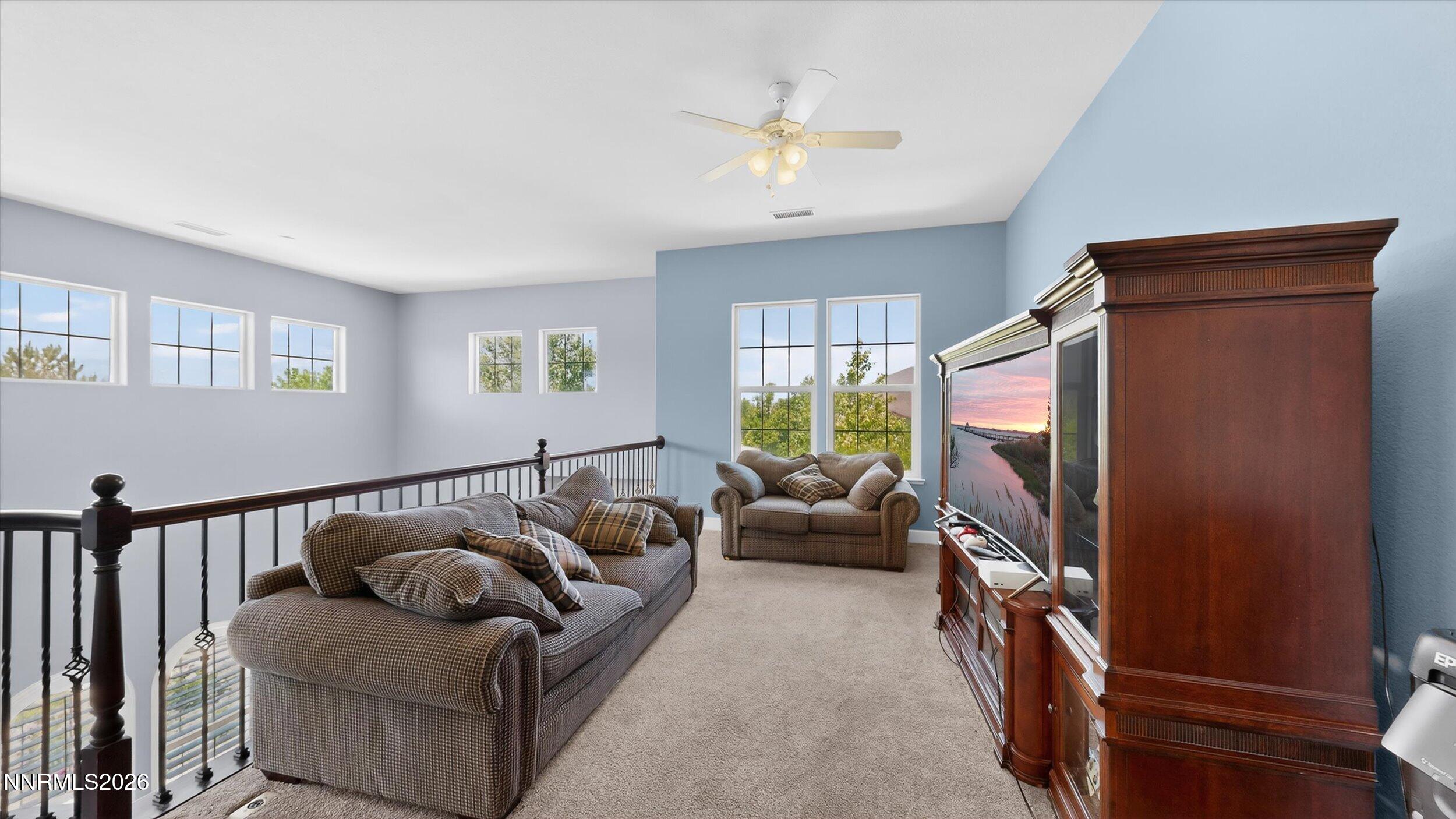 2920 Bull Rider Drive Reno, NV 89521 - Photo 20 of 51 a living room with furniture and a flat screen tv