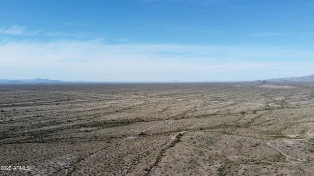 a view of an ocean beach and mountain
