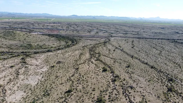 a view of an ocean beach and mountain