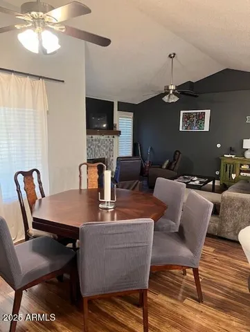 a dining room with furniture and window